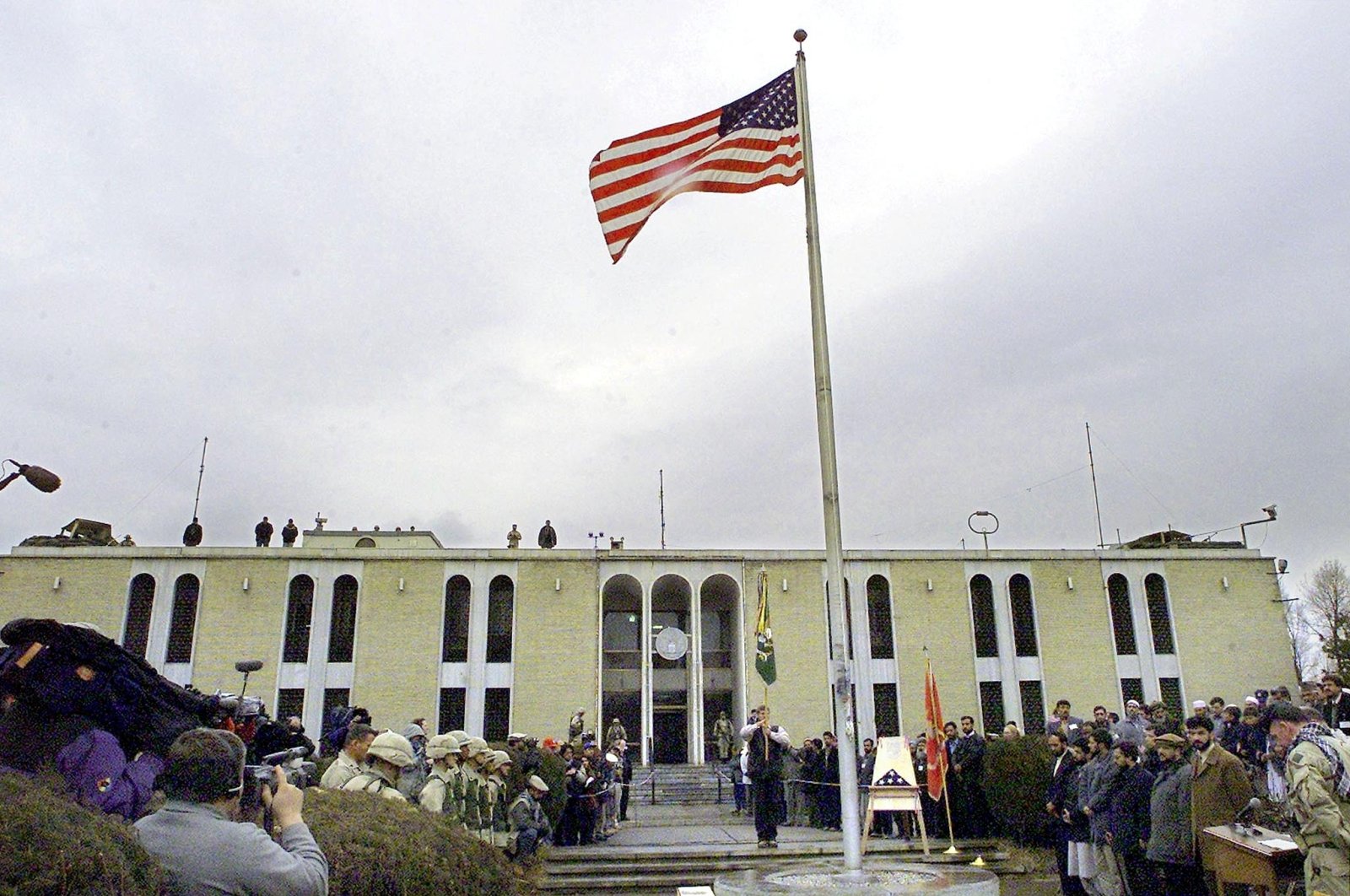 The American flag flutters after it was raised at the opening ceremony of the U.S. Embassy in the Afghani capital of Kabul, Afghanistan, Dec. 17, 2001. (AFP File Photo)