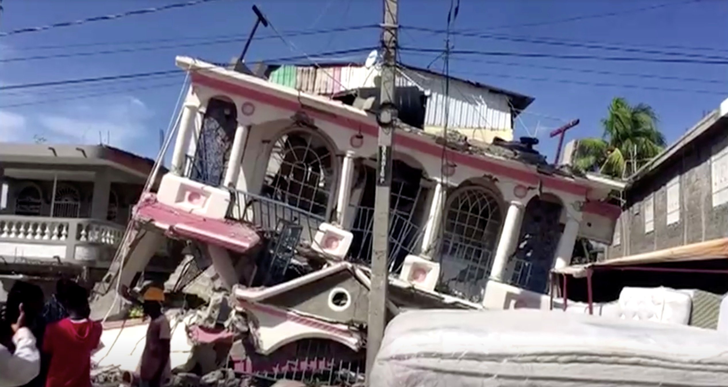A view of a collapsed building following an earthquake, in Les Cayes, Haiti, in this still image taken from a video obtained by Reuters on August 14, 2021.(Reuters TV via Reuters)
 