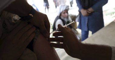 A woman receives the Johnson & Johnson COVID-19 vaccine at a vaccination center with COVID-19 vaccines delivered through the U.N.-backed COVAX program, in Kabul, Afghanistan, July 11, 2021. (AP Photo)