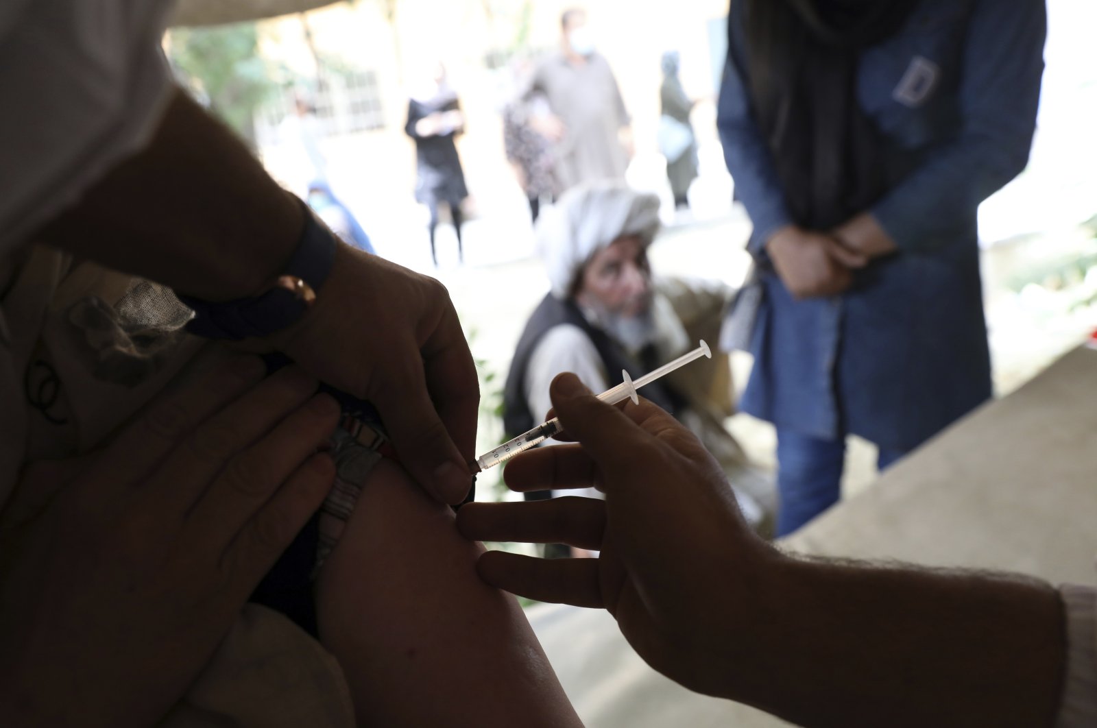 A woman receives the Johnson & Johnson COVID-19 vaccine at a vaccination center with COVID-19 vaccines delivered through the U.N.-backed COVAX program, in Kabul, Afghanistan, July 11, 2021. (AP Photo)