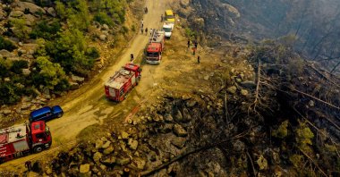 Firefighting teams rush to fields destroyed by wildfires as part of the campaign to fight the nationwide disaster, Manavgat, Antalya, southern Turkey, Aug. 4, 2021. (AA Photo)
