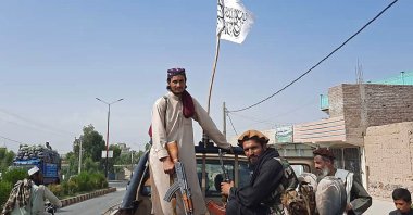 Taliban fighters drive an Afghan National Army (ANA) vehicle through the streets of Laghman province, Afghanistan, Aug. 15, 2021. (AFP Photo))