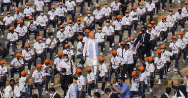 Indian Prime Minister Narendra Modi greets schoolchildren after addressing the crowd from the historic 17th century Red Fort during Independence Day celebrations, New Delhi, India, Aug. 15, 2021. (AP Photo)
