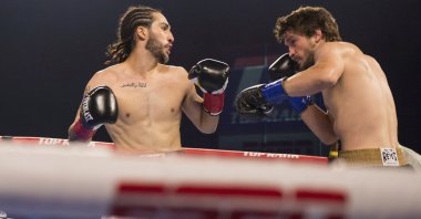 Nico Ali Walsh (L) faces Jordan Weeks during a middleweight boxing bout, Tulsa, Oklahoma, U.S., Aug. 14, 2021. (AP Photo)