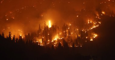 The Dixie fire burns the forest in the mountains as seen from Taylorsville, California, U.S., Aug. 13, 2021. (EPA Photo)