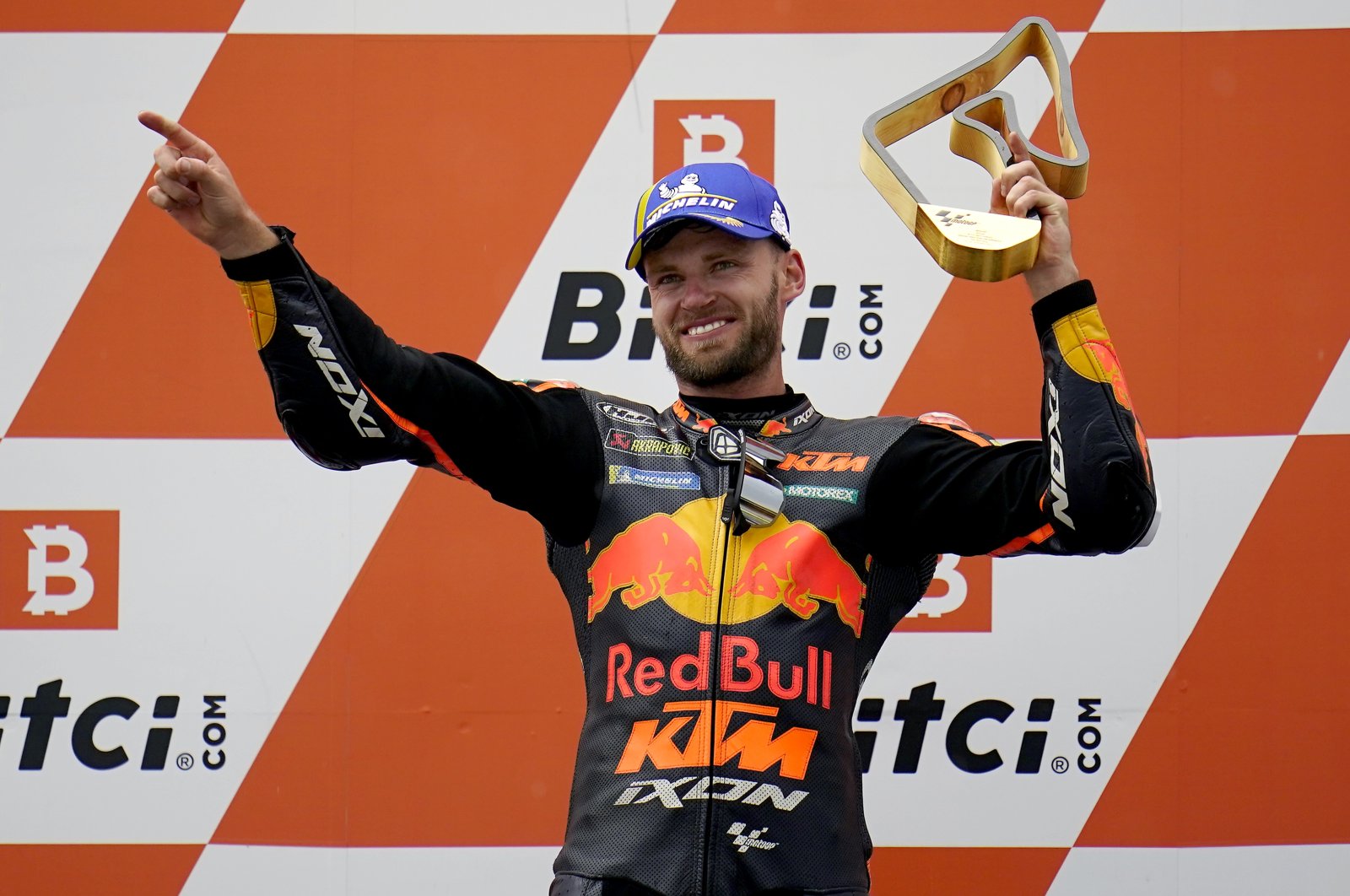 South Africa's Brad Binder celebrates winning the Austrian motorcycle Grand Prix at the Red Bull Ring in Spielberg, Austria, Aug. 15, 2021. (AP Photo)
