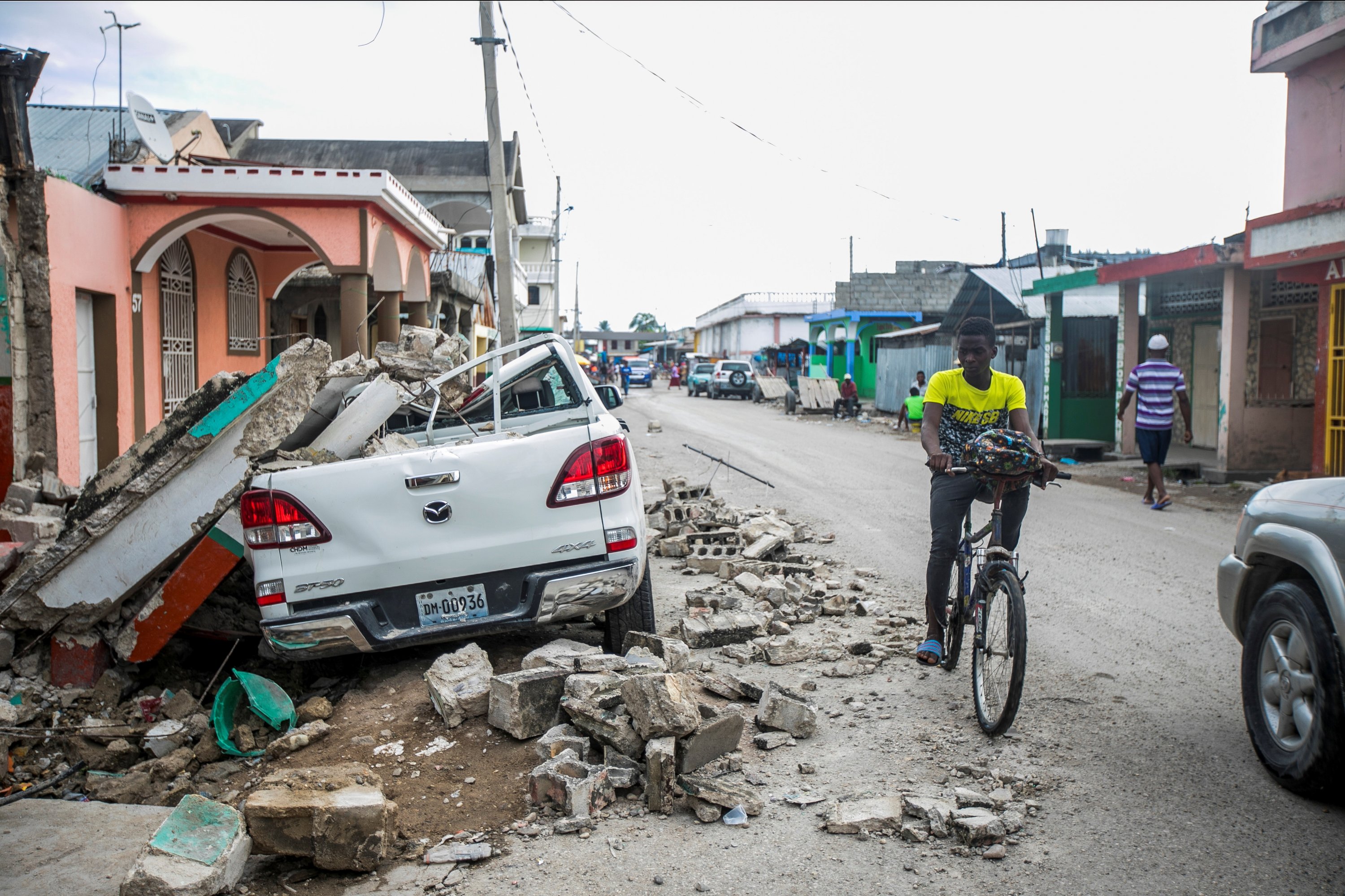 A car damaged is pictured under debris after a 7.2 magnitude earthquake in Les Cayes, Haiti, Aug. 15, 2021. (Reuters Photo)