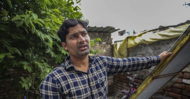 Mohammed Irfan, 24, stands outside his home in Nanded, Maharashtra state, India, on Aug. 3, 2021. (AP Photo)