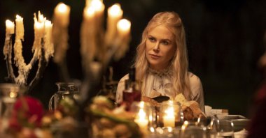 Nicole Kidman sits on a table in a scene from the series "Nine Perfect Strangers," premiering Aug. 18 on Hulu. (Hulu via AP)