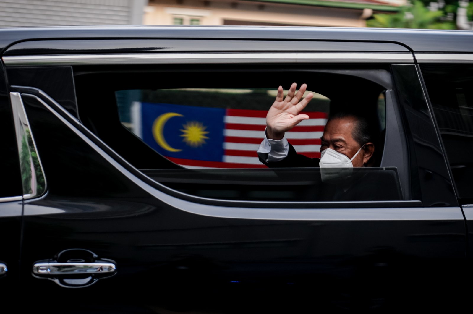 Malaysia's Prime Minister Muhyiddin Yassin waves as he arrives at the National Palace in Kuala Lumpur, Malaysia, on Aug. 16, 2021, as he was expected to quit after just 17 months in office. (AA Photo)