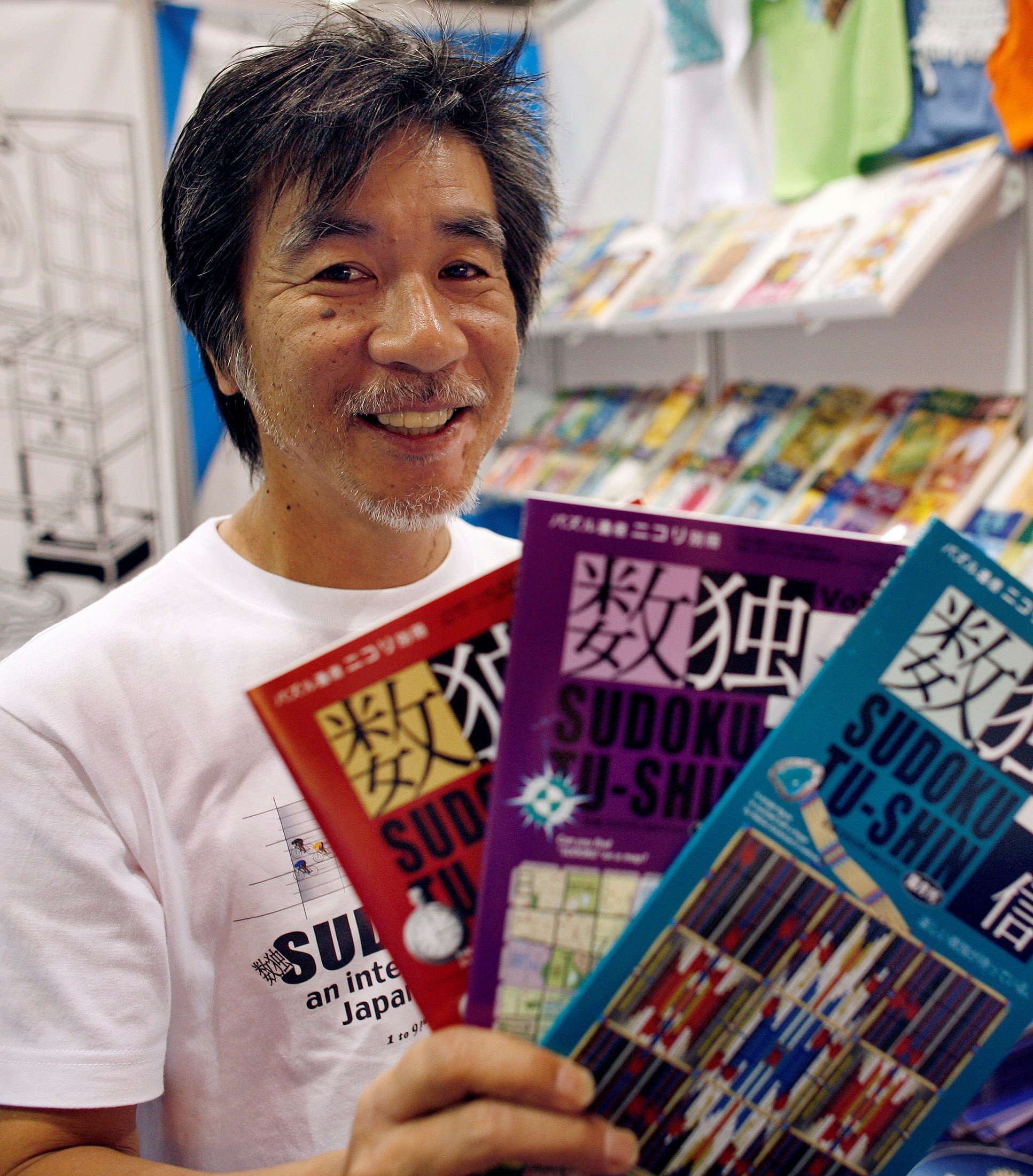  'Father of Sudoku' Maki Kaji holds copies of the latest sudoku puzzles at the Book Expo, in New York, June 3, 2007. (Reuters Photo) 