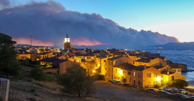 Smoke rises from a massive wildfire in Gonfaron, seen from the heights of Saint Tropez, south of France , Aug. 16, 2021. (Reuters Photo)