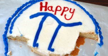 The symbol of the mathematical constant pi can be seen on the remnants of a cake. (Gettty Images)