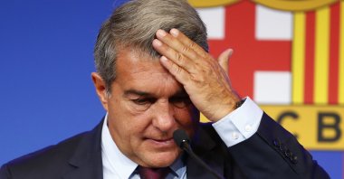 Barcelona club President Joan Laporta begins a news conference in Barcelona, Spain, Friday, Aug. 6, 2021. (AP Photo)