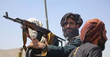 Taliban fighters stand guard in a vehicle along the roadside in Kabul, Afghanistan, Aug. 16, 2021. (AFP Photo)