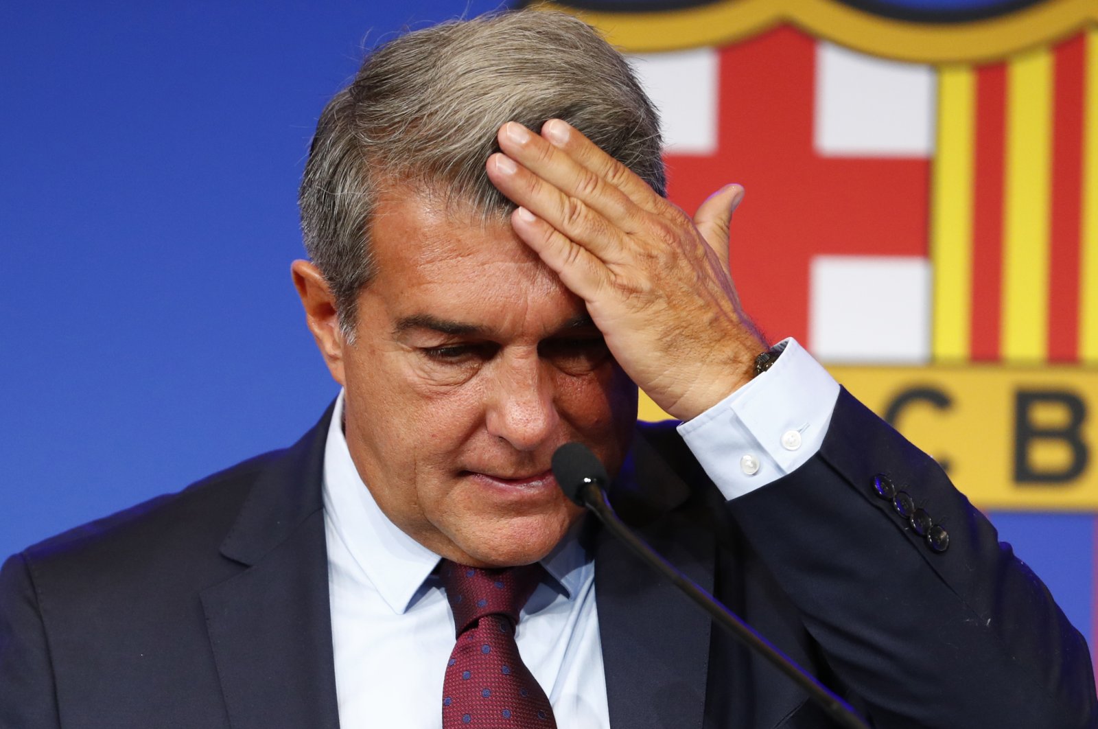 Barcelona club President Joan Laporta begins a news conference in Barcelona, Spain, Friday, Aug. 6, 2021. (AP Photo)