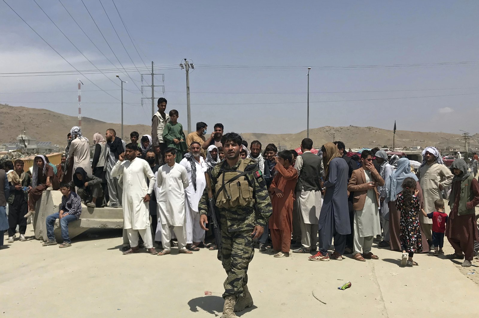 Hundreds of people gather outside Kabul Hamid Karzai International Airport, Kabul, Afghanistan, Aug. 17, 2021. (AP Photo)