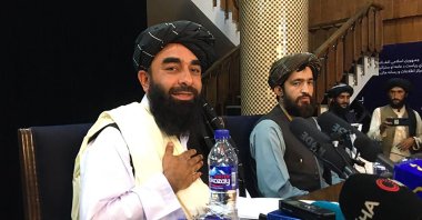 Taliban spokesperson Zabihullah Mujahid (L) attends the first press conference following their stunning takeover of Afghanistan in Kabul, Afghanistan, on Aug. 17, 2021. (AFP Photo)