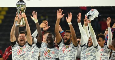 Bayern Munich's Robert Lewandowski lifts the German Super Cup trophy after beating Borussia Dortmund, Dortmund, Germany, Aug. 17, 2021. (AFP Photo)