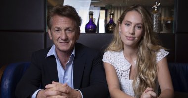 Sean Penn (L), and Dylan Penn pose for portrait photographs for the film "Flag Day," at the 74th international film festival, Cannes, southern France, July 10, 2021. (AP Photo)