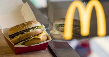 A McDonald's Big Mac is seen alongside the blurred McDonald's golden arches logo, in Hong Kong, Aug. 2, 2018. (Getty Images)