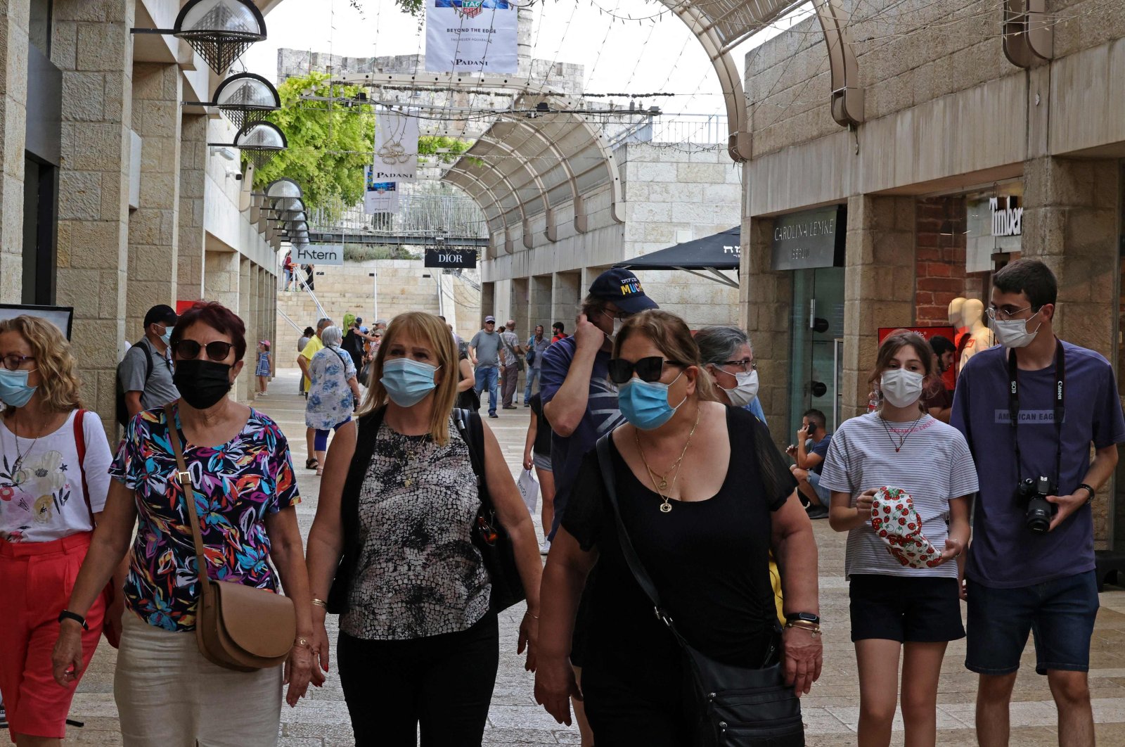 People wear masks against the coronavirus as they walk at a market in Jerusalem, Israel, Aug. 11, 2021. (AFP Photo)