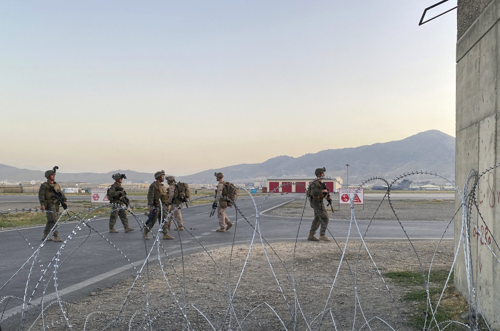 U.S. soldiers stand guard along a perimeter at the international airport in Kabul, Afghanistan, Aug. 16, 2021. (AP Photo)