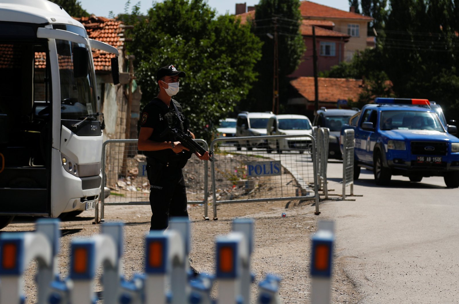 A Turkish riot police member stands guard at a checkpoint on a road which leads to a neighborhood where many Syrian refugees have houses and shops, in Ankara, Turkey, Aug. 12, 2021. (REUTERS Photo)