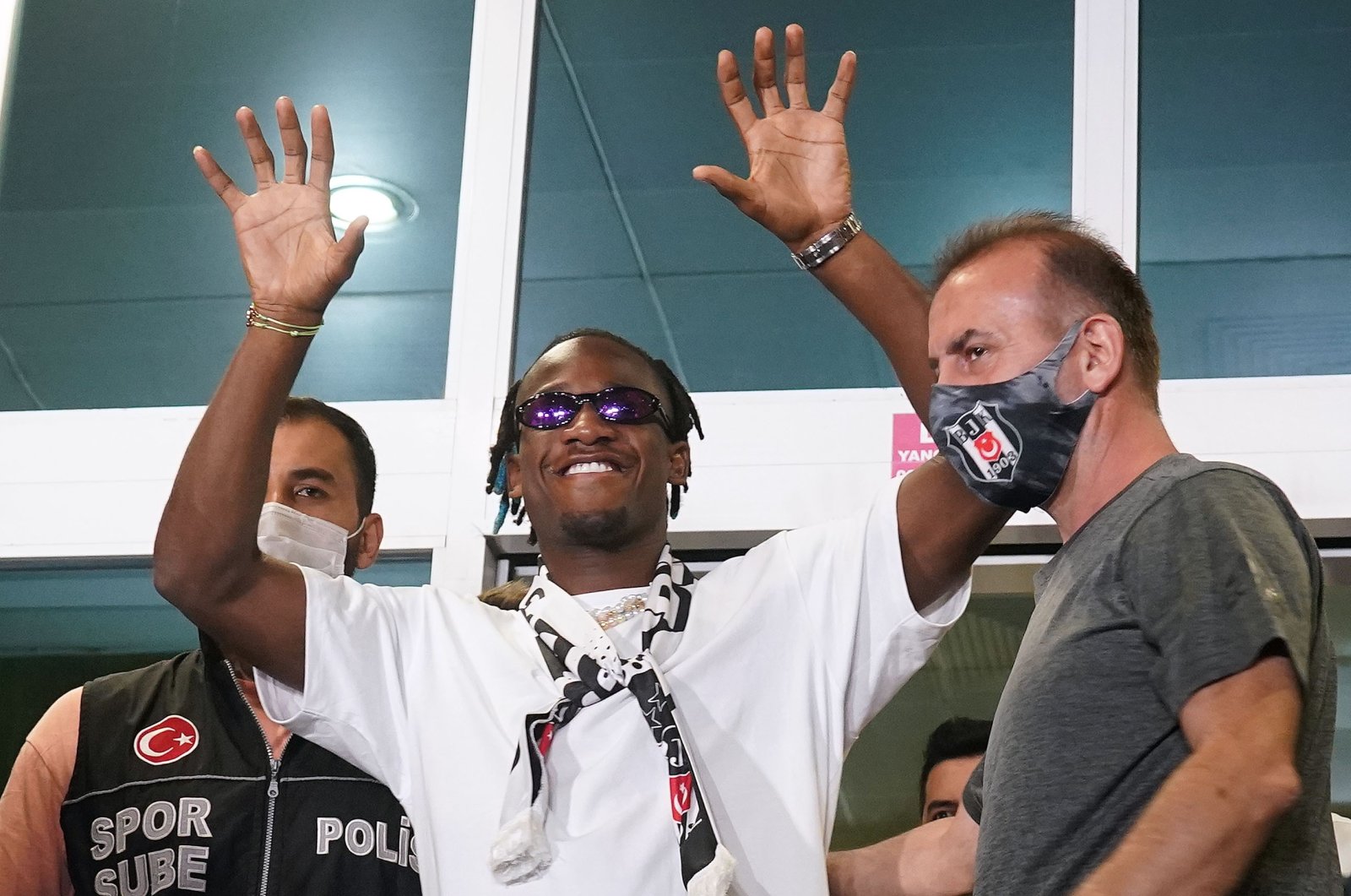 Beşiktaş's Chelsea loanee Michy Batshuayi gestures at club fans and supporters after arriving in Istanbul on a seasonlong deal, Aug. 17, 2021.