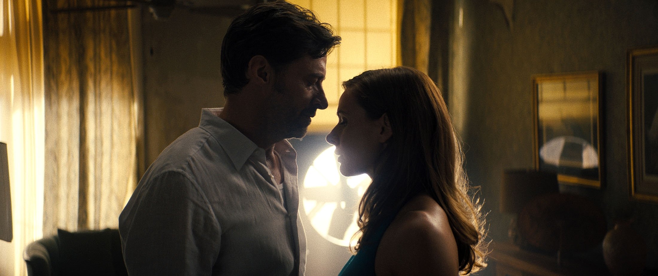 Hugh Jackman (L) and Rebecca Ferguson in a scene from the film "Reminiscence." (Warner Bros. Pictures via AP)