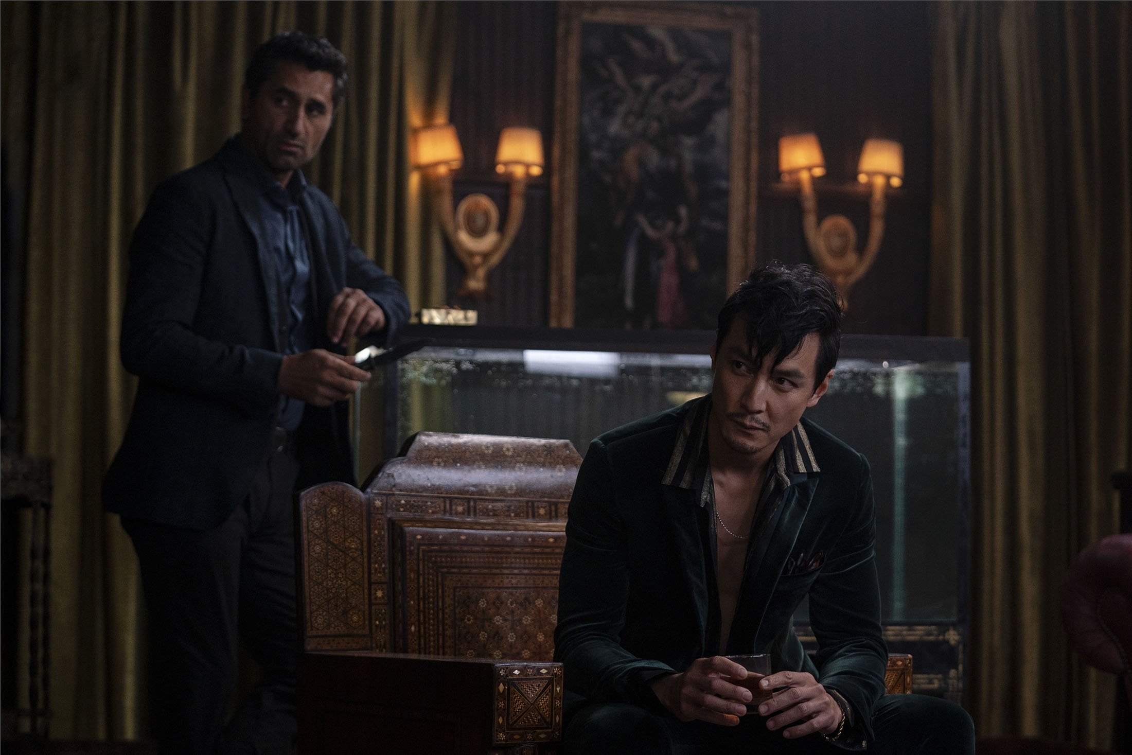Cliff Curtis (L) and Daniel Wu in a scene from the film "Reminiscence." (Warner Bros. Pictures via AP)