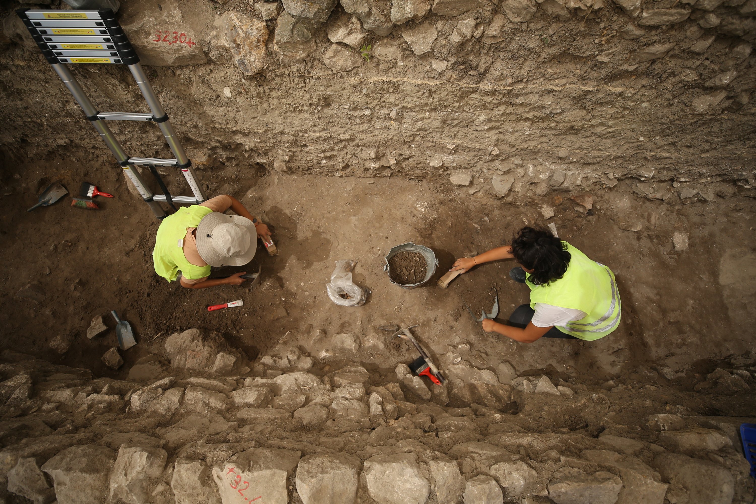 Archaeologists work in the 2,600-year-old kitchen structure in the ancient city of Daskyleion, Balıkesir, western Turkey, Aug. 17, 2021. (AA Photo)