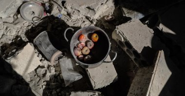 Food remains are seen between the rubble of a residential house that was targeted by a missile shelling carried out by the Syrian regime at the village of Iblin in Idlib,  Syria, July 22, 2021. (Getty Images)