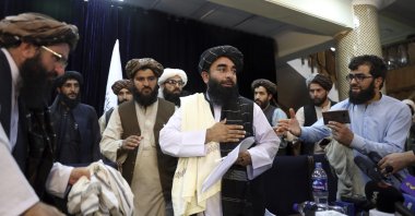Taliban spokesperson Zabihullah Mujahid (C) leaves after his first news conference, in Kabul, Afghanistan, Aug. 17, 2021. (AP Photo)