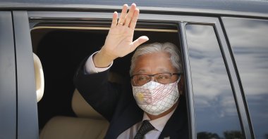 Former Deputy Prime Minister Ismail Sabri Yaakob waves to media as he leaves after a meeting with the king at national palace in Kuala Lumpur, Malaysia, Aug. 19, 2021. (AP Photo)