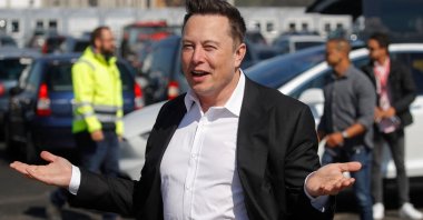 Tesla CEO Elon Musk gestures as he arrives at the construction site of the future factory of U.S. electric car giant Tesla, in Gruenheide near Berlin, Germany, Sept. 3, 2020.  (AFP Photo)