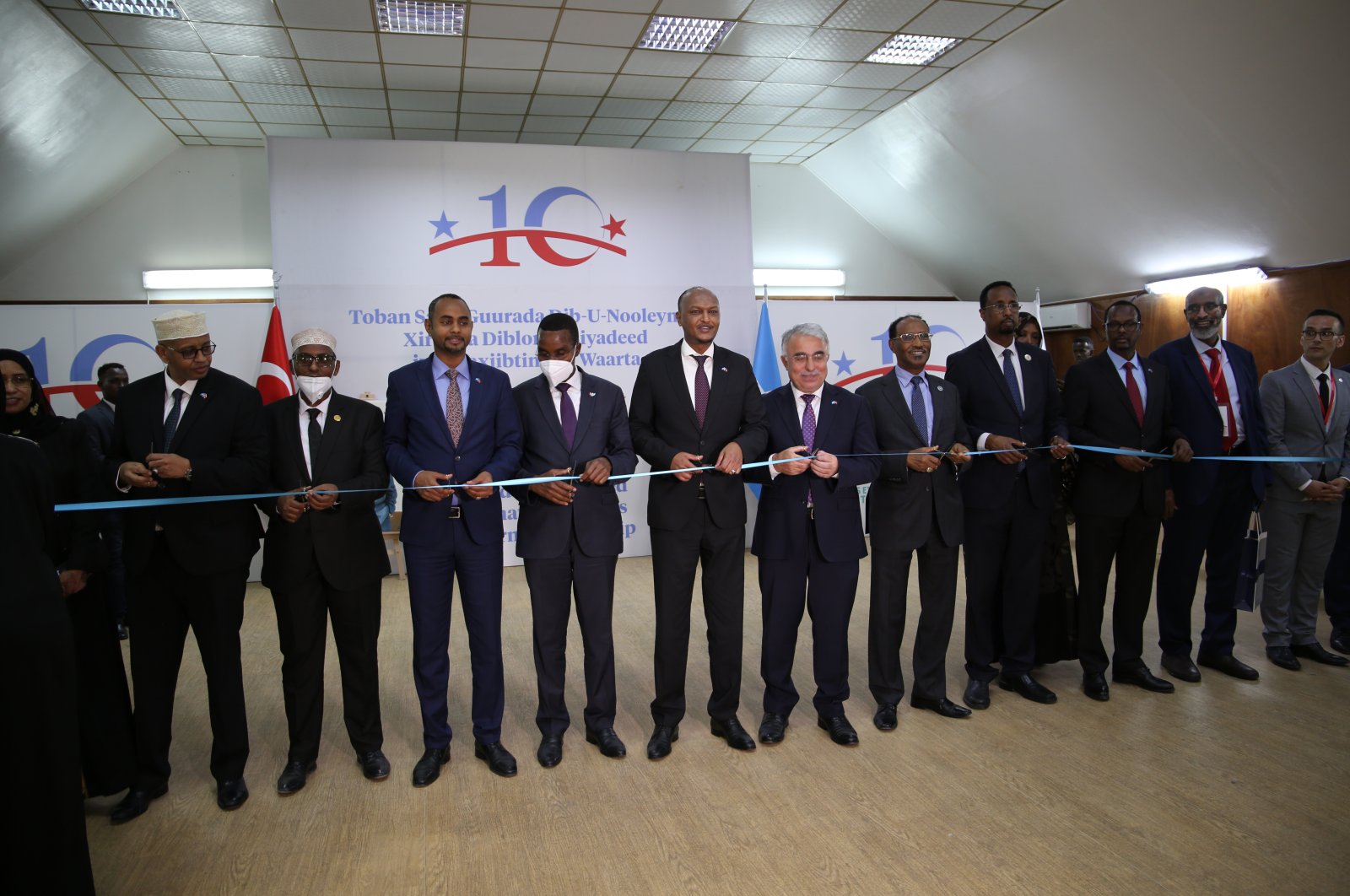 Officials cut a ribbon during a ceremony to mark 10 years of Turkish and Somali relations, in Mogadishu, Somalia, Aug. 19, 2021. (AA Photo)