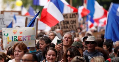 Protesters attend a demonstration against France's restrictions, including a compulsory health pass, to fight the COVID-19 outbreak, in Paris, France, Aug. 21, 2021. (Reuters Photo)