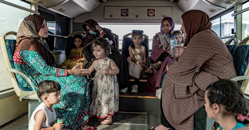 An Afghan family arrives at Islamabad Airport after their evacuation from Kabul by Belgian forces called Red Kite mission, Islamabad, Pakistan, Aug. 20, 2021. (Belgian Defense Ministry via EPA Photo)