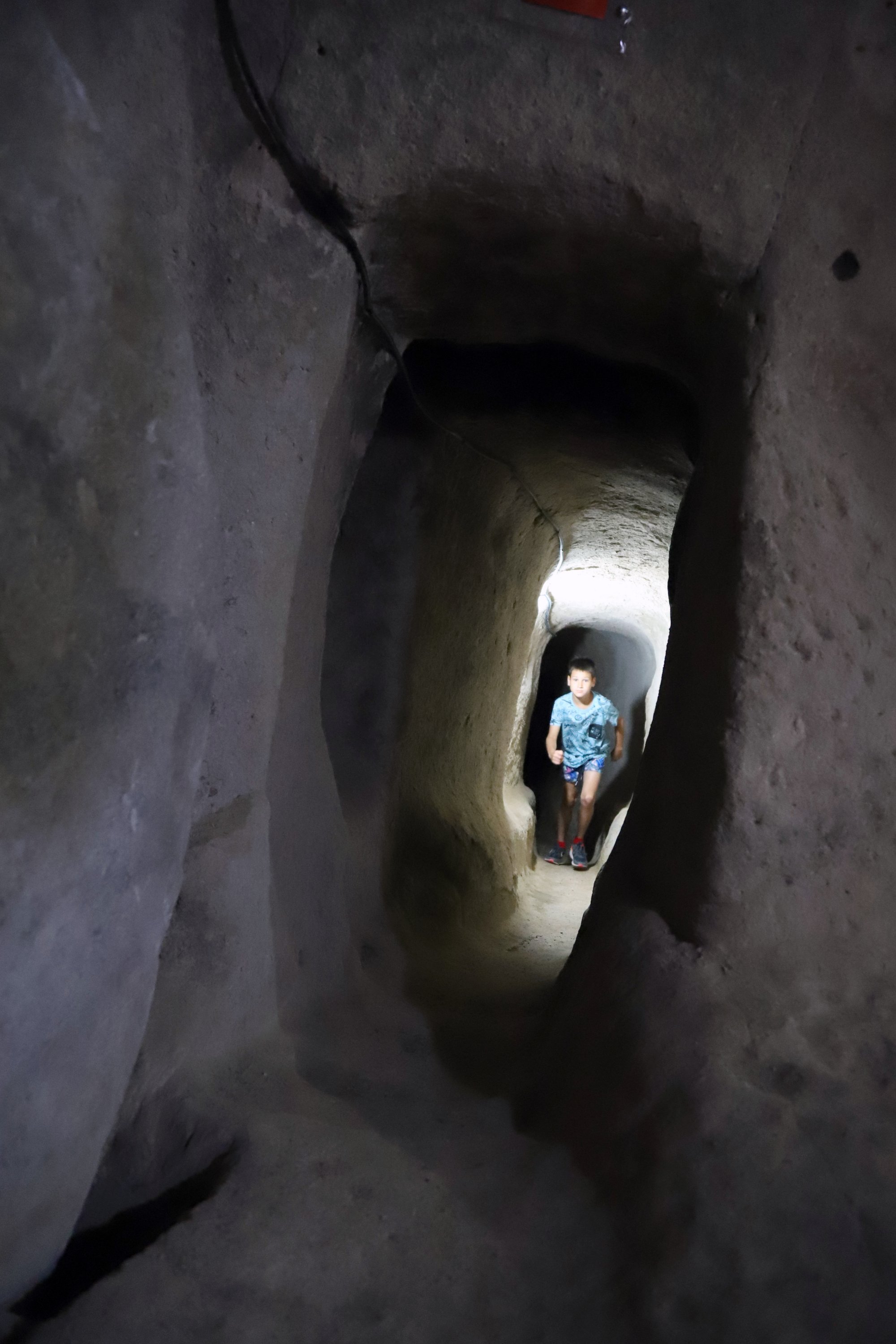 A visitor in the tunnels of the underground city of Saint Mercurius, in Aksarayi, central Turkey, August 19, 2021. (Photo AA)
