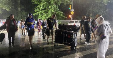 People are seen leaving a concert amid the Hurricane Henri's advance into the northeastern United States on Aug. 22, 2021 (AA Photo)