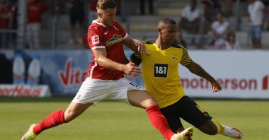 Freiburg’s Ermedin Demirovic (L) in action against Dortmund’s Manuel Akanji (R) during a German Bundesliga match in Freiburg, Germany, Aug. 21, 2021. (EPA Photo)