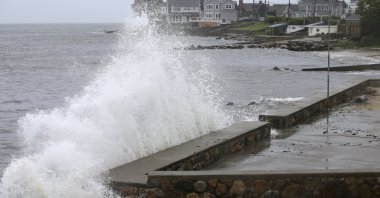 Waves crash against the sea wall along Pequot Avenue in New London, Conn. U.S., as Tropical Storm Henri approaches, Aug. 22, 2021. (AP Photo)
