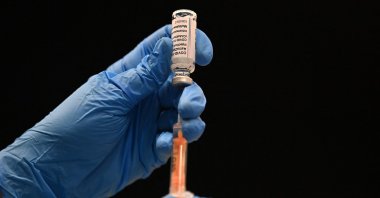 A health care professional draws up a dose of Oxford/AstraZeneca's COVID-19 vaccine at the vaccination center set up inside Brighton Center in Brighton, southern U.K., Jan. 26, 2021. (AFP Photo)