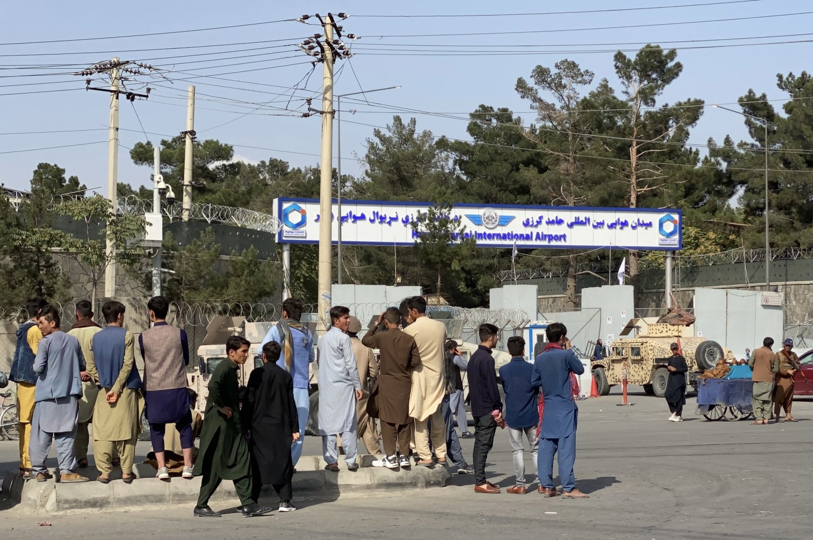 Afghans gather outside the Hamid Karzai International Airport to flee the country, in Kabul, Afghanistan, Aug. 20, 2021. (EPA Photo)