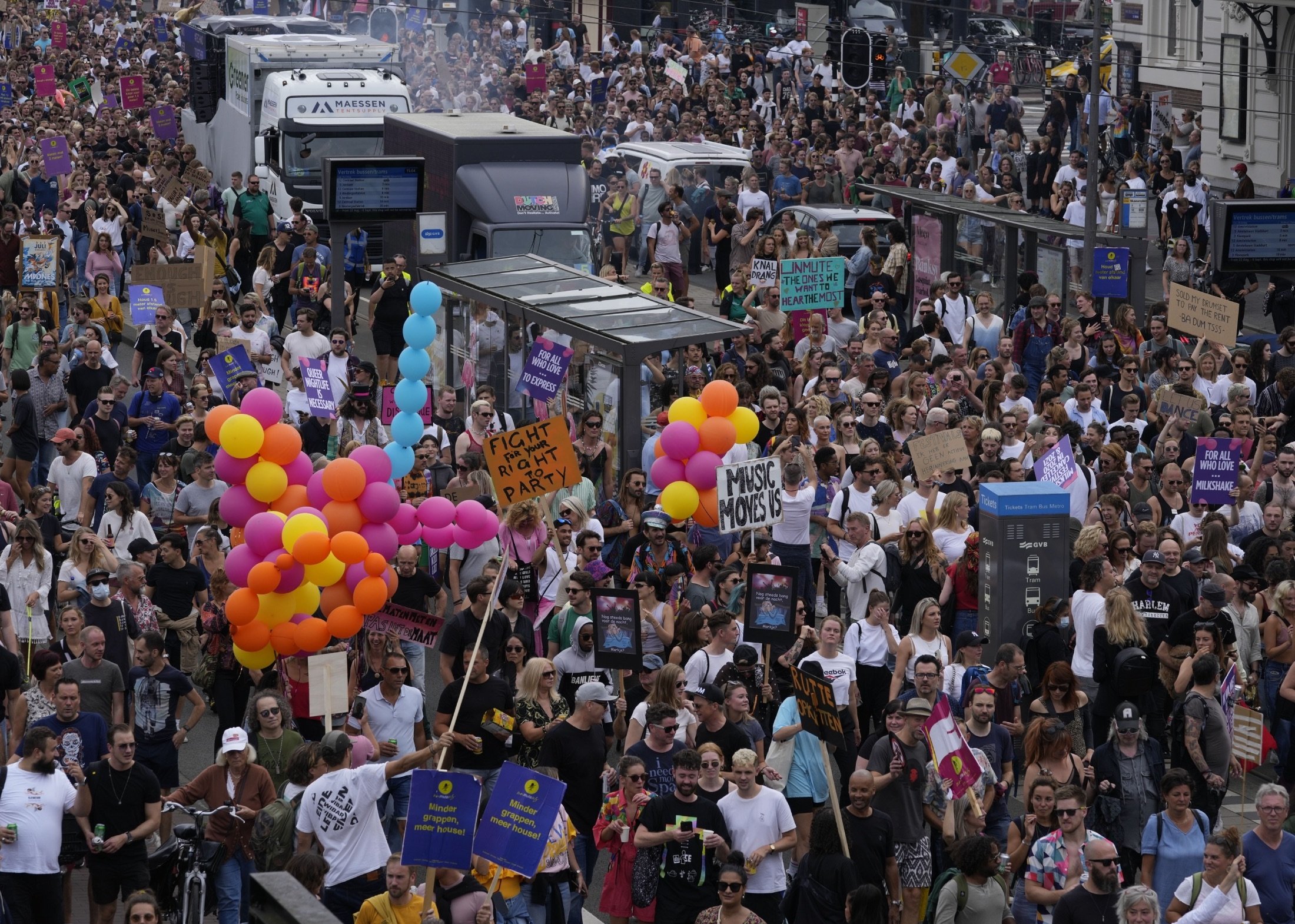 Thousands of fans of music festivals stage protests against the government's COVID-19 restrictions on large-scale outdoor events, in Amsterdam, Netherlands, Aug. 21, 2021. (AP Photo)