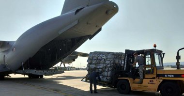 Aid packages are being loaded onto the plane, in the capital Ankara, Turkey, Aug. 23, 2021. (DHA Photo)