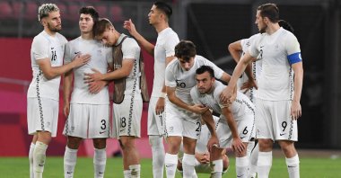 New Zealand players react to their defeat in the Tokyo 2020 Olympic Games men's quarterfinal against Japan at Ibaraki Kashima Stadium in Kashima, Ibaraki prefecture, July 31, 2021. (AFP Photo)