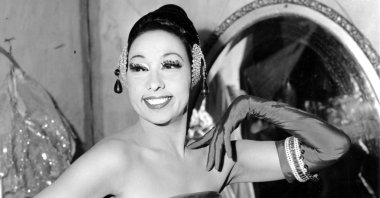 Singer Josephine Baker poses in her dressing room at the Strand Theater in New York City, U.S., March 6, 1961. (AP Photo)