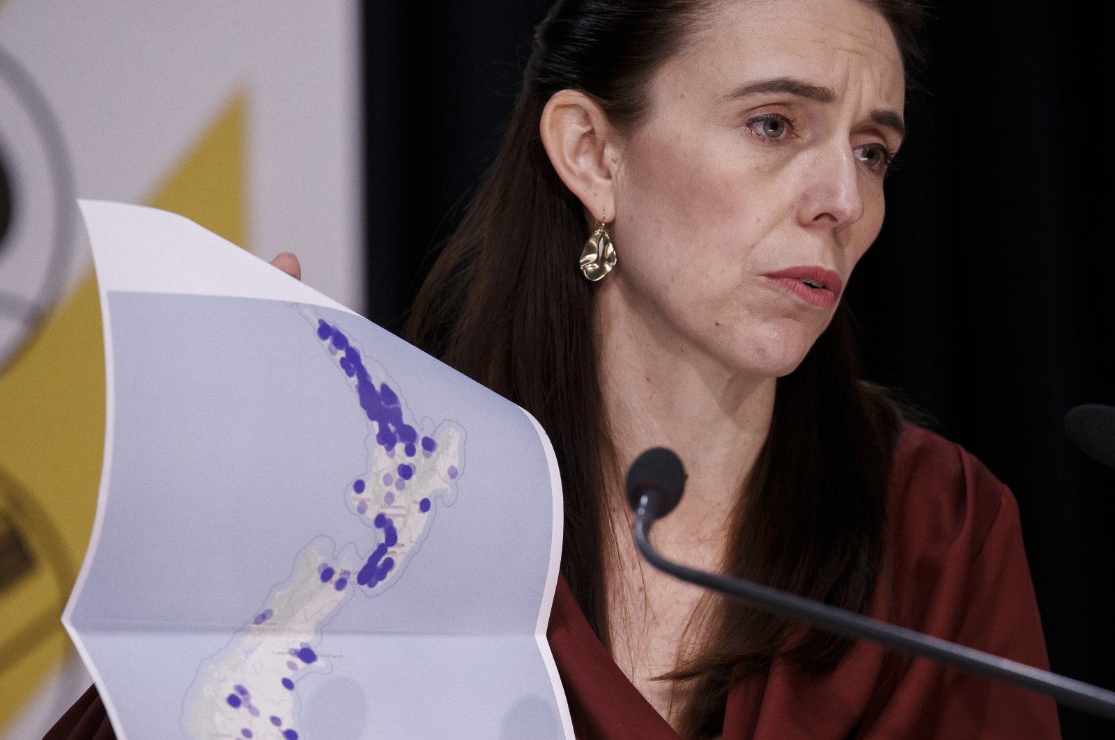 New Zealand Prime Minister Jacinda Ardern holds a map of New Zealand during a COVID-19 update press conference in Wellington, New Zealand, Monday, Aug. 23, 2021. (AP Photo)